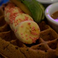 half quinoa waffle meal with soho hoy tofu and replaced the just egg with avocado at Nourish Cafe in San Francisco