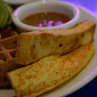 half quinoa waffle meal with soho hoy tofu and replaced the just egg with avocado at Nourish Cafe in San Francisco