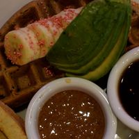 half quinoa waffle meal with soho hoy tofu and replaced the just egg with avocado at Nourish Cafe in San Francisco