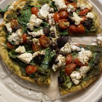 Veggie Pizza—Kite Hill ricotta, pesto, tomatoes, mushrooms, spinach  at Nourish Cafe in San Francisco