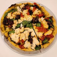 Veggie pizza with kite hill ricotta at Nourish Cafe in San Francisco