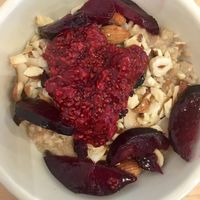 Sweet Morning Bowl (warm oatmeal w. different types of berries, nuts and coconut)  at Nourish Cafe in San Francisco