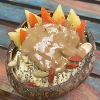 Green goddess bowl with peanutbutter on top  at Raw Love - Downtown Tulum in Tulum