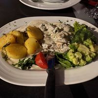 Vegan Steaks, mushroom sauce, rosemary potatoes and broccoli  at La Taverna in Lueneburg