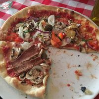 half  vegetable pizza with vegan cheese. at La Trattoria in Malmo