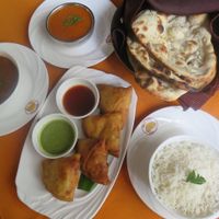 Naan bread, rice, curries and veggie samosas. at Buena Vista Curry Club in Havana