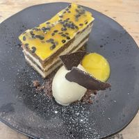 Passionate fruit and almond cake with chocolate sponge and a mango coulis  at Cradle in Sudbury