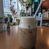 Iced coffee with Carmel cold foam at Springhouse in Halifax