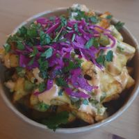 (Ninas taco truck) Dirty fries: seasoned fries topped with cheeze sauce, jalapeños, red cabbage, crispy onions and chipotle mayo  #Veganuary at GRUB in Manchester
