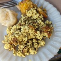 tofu mexido, pão de queijo e tortinha de frango vegetal at Padoca Vegan in Sao Paulo