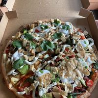 Half half family pizza with vegan nacho and vegan satay at Riptide Pizza in Woolgoolga