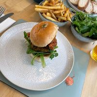 bhaji burger, fries, salad and houmous  at Pip's The Railway Carriage Cafe in Ilminster