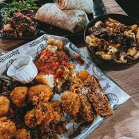 Platter, chicken wrap & poutine (curry sauce in background) at Down the Hatch in Liverpool