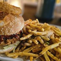 Crispy seitan burger with jackfruit and salt n pepper fries. at Down the Hatch in Liverpool
