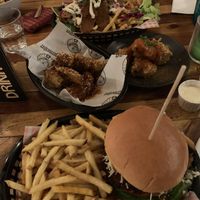 Burger and fries, donner fries, seitan wings with sweet chilli jäger glaze and jackfruit bites with buffalo sauce (little spicy)  at Down the Hatch in Liverpool