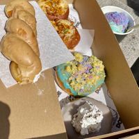 Cookie butter twist, bacon Mac and cheese, birthday cake, Portland fog and birthday cake ice cream with Cotton candy sprinkles  at Doe Donuts in Portland