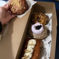 From top: Pumpkin pecan roca, taro milk tea, banana cream pie long john + fritter on the side at Doe Donuts in Portland