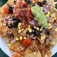Vegan Nachos - needs cheese or crema of some kind   at Happy Burger Diner in Mariposa