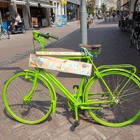 bike at other side of shopping street with add for Imagine at Imagine in Middelburg
