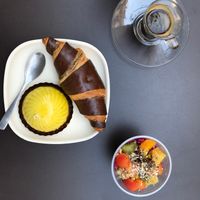 Chocolate croissant, citrus dome, acai cup, espresso at Laelo in Paris