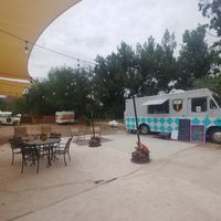 Outdoor space and the truck. Outdoor carpet is a foreign concept in Seattle or Houston... at Moab Kitchen in Moab