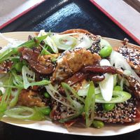 Gyoza dumplings with sweet sauce, edamame, and green vegetables at Foodstock  in Bratislava