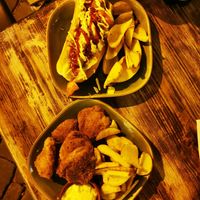Vegan Hotdog and vegan nuggets with fries at Petite Sophie in Mahon