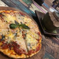 Herb and garlic vegetarian pizza at Atman Nourish Kafe in Ubud