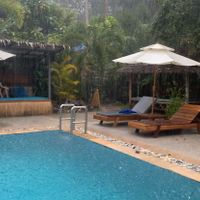 Pool area on a rainy day   at Wonderland Healing Center Vegan Buffet in Koh Phangan