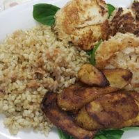 crab cakes with coconut rice and plantains at Universal Love Vegan Cafe  in Columbia