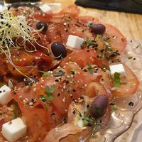 Carpaccio de tomate y queso vegano estilo feta. Riquísimo este queso! at Mapa Verde in San Sebastian