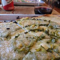 Basil pesto sauce, candied jalapeños, vegan cheese on a gf crust. Yummy! at The Couch Tomato  in Manayunk