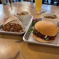 Vegan wrap and vegan burger with potatoes as the side. Mmm.  at FarmHand Kchn in St Augustine