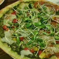 Green pizza, one half with tom, one half with pesto at Rad Rabbit in Chiang Mai
