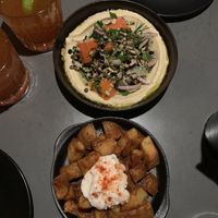 Fekkeh hummus and crispy potatoes with a garlic sauce at The Hummus Club in Northbridge