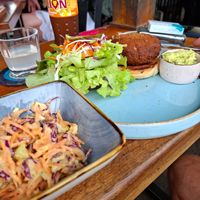 Jackfruit burger with guacamole and coleslaw salad at Rainbow Cafe in Ella