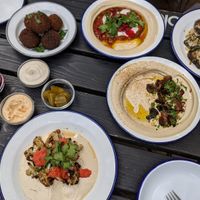 Hummus chili sin carne, hummus with mushrooms, roasted cauliflower, eggplant (plus bread, fries, falafel, pickles and sauces) at Mashery - Hummus Kitchen in Cologne