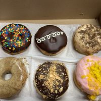 Cosmic brownie; fauxstess; tiramisu; chai; cannoli; and lemon raspberry  at Misfit Doughnuts & Treats in Rochester