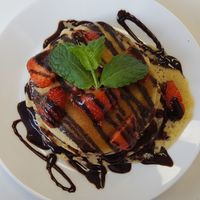 pancakes with strawberries and chocolate sauce at 143V in Cork