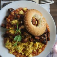 Bagel with vegan omelet, beans, seitan and mushrooms. at 143V in Cork