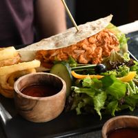 Jackfruit wrap with onion rings at Kismet Restaurant & Lounge in Ubud