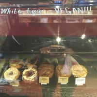 Donut Display. White tags indicate vegan items at West Town Bakery - River North in Chicago