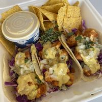 Buffalo tacos with chips and queso  at Juice Pharm in Duluth