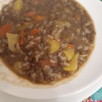 Super flavorful lentils with rice and veggies for first plate of meal of the day. at Telos Comida Casera Natural Vegetariana y Vegana in San Lorenzo De El Escorial