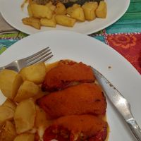 The two second plate options for our meal of the day: quinoa stuffed squash in one and fake meat stuffed peppers in the other, both with potatoes.  at Telos Comida Casera Natural Vegetariana y Vegana in San Lorenzo De El Escorial