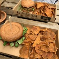 Burgers and potato crisps at Tökmag Vegan Street Food in Budapest