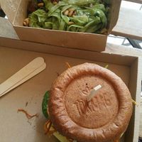 Pesto pasta and green pea burger at Tökmag Vegan Street Food in Budapest