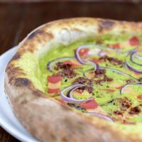 Peas cream and vegan bacon 🌱  at Pizzi & Dixie in Madrid