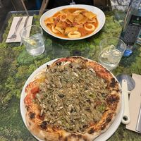 pistachio garlic pizza and calamari pasta  at Pizzi & Dixie in Madrid