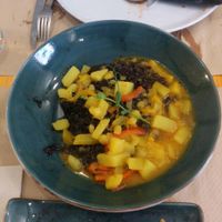 Potatoes and black rice curry at Pizzi & Dixie in Madrid